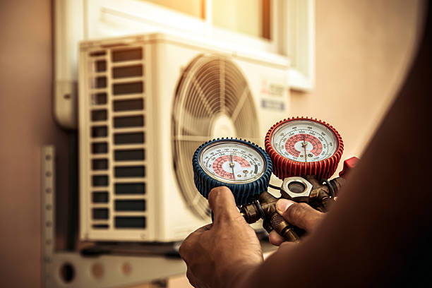 Professional Air Conditioning Service technician working in Grand Terrace, CA
